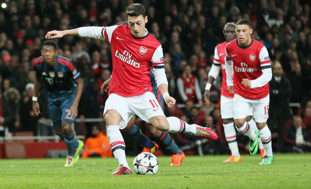 Arsenal's Mesut Ozil misses to score with a penalty during a Champions League, round of 16, first leg soccer match between Arsenal and Bayern Munich at the Emirates stadium in London, Wednesday. AP Arsenal's Mesut Ozil misses to score with a penalty during a Champions League, round of 16, first leg soccer match between Arsenal and Bayern Munich at the Emirates stadium in London, Wednesday. AP